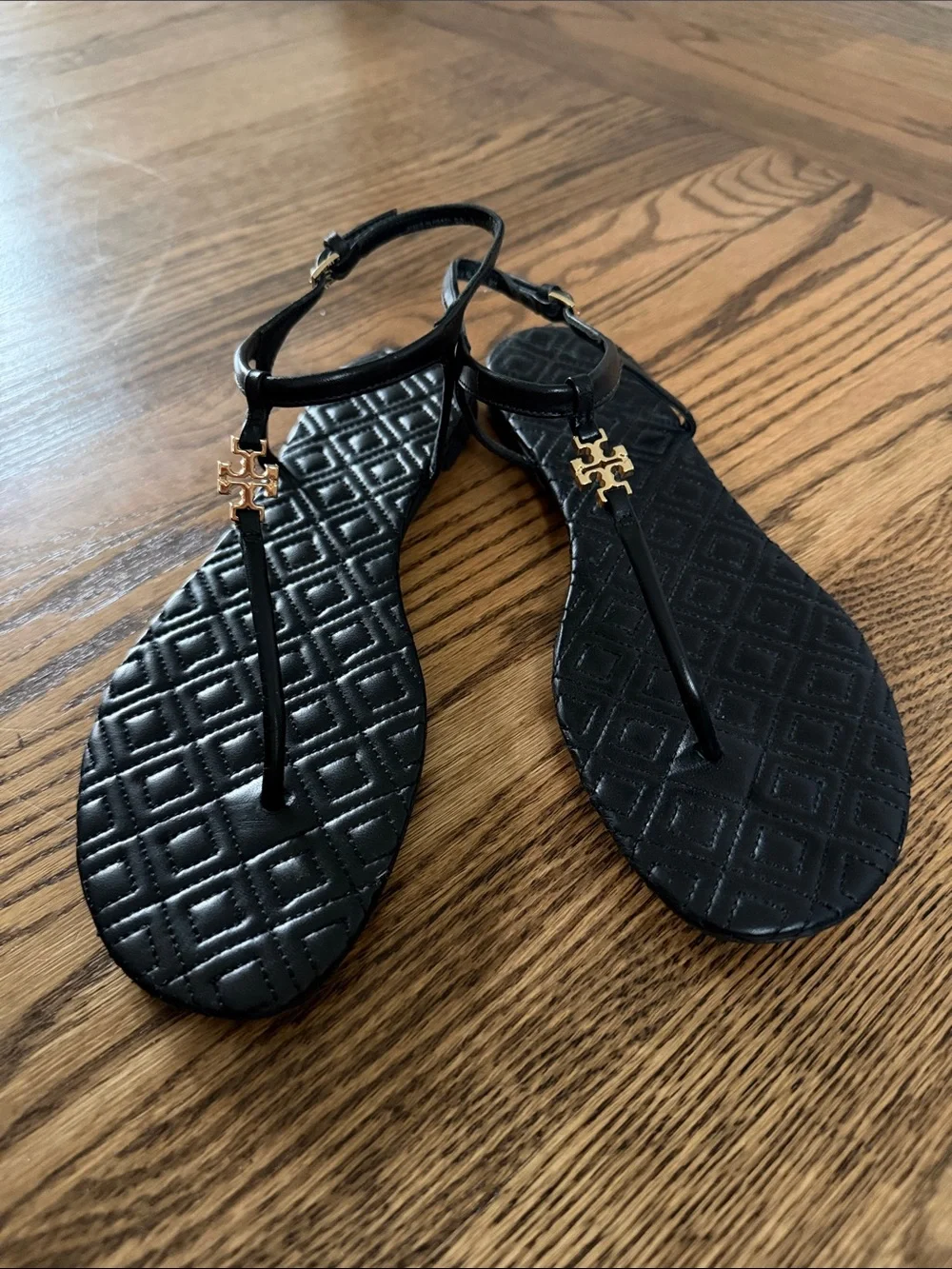 Tory Burch Black Quilted Leather T-Strap Sandals with Gold Logo Hardware